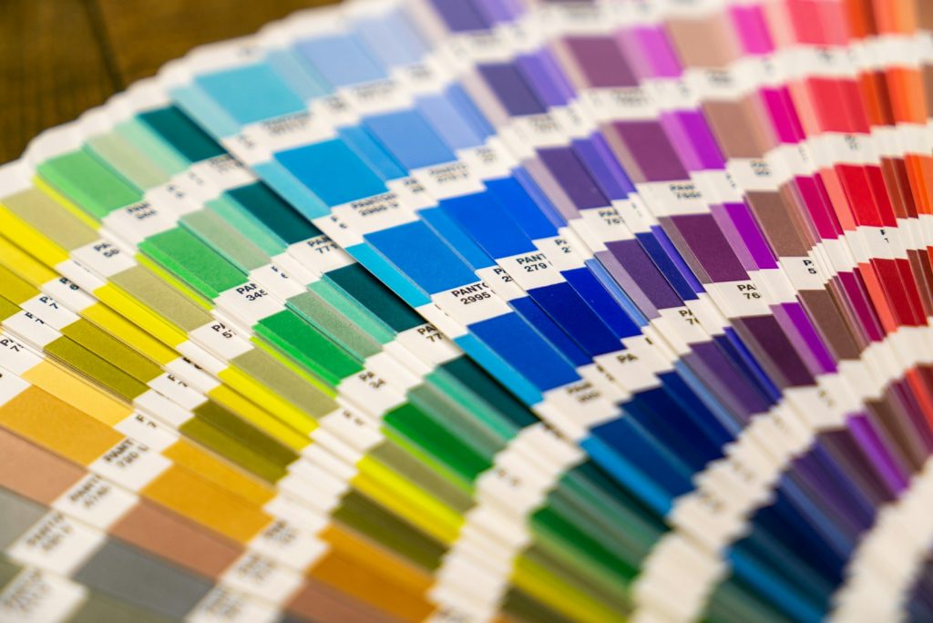 Color psychology concept: fan deck of paper swatches arranged in a color spectrum